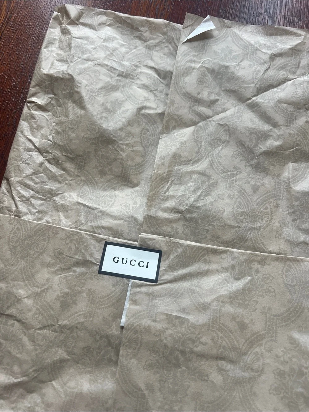 Gucci tissue paper with sticker logo